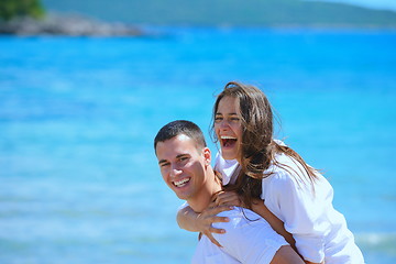 Image showing happy couple have fun on the beach