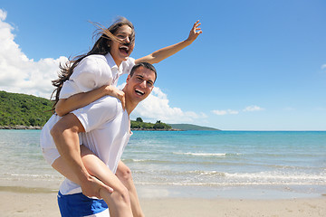 Image showing happy couple have fun on the beach