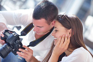 Image showing couple looking photos on camera