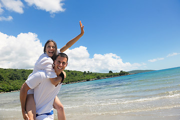 Image showing happy couple have fun on the beach