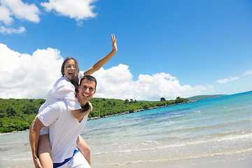 Image showing happy couple have fun on the beach