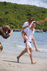 Image showing photographer taking photo on beach