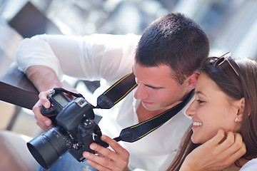 Image showing couple looking photos on camera