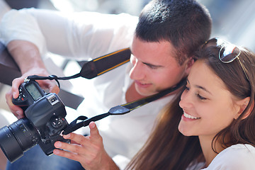 Image showing couple looking photos on camera