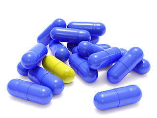 Image showing Blue and yellow pills on white