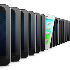 Image showing Beautiful white smartphone in row of black phones