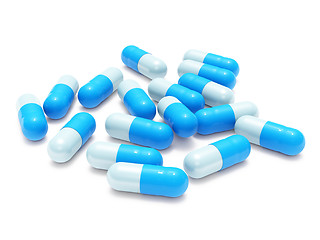 Image showing Many blue-gray pills on white