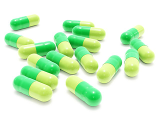 Image showing Many green pills on white