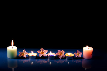 Image showing flowers with candles