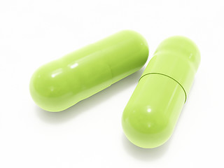 Image showing Two green pills on white