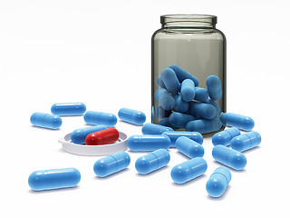 Image showing Blue and red pills in medical bottle with cap