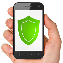 Image showing Hand holding smartphone with shield on display