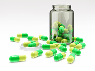 Image showing Green-yellow pills in medical bottle with cap
