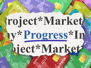 Image showing Torn newspaper with words Progress on credit card background