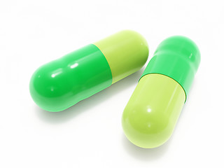 Image showing Two green pills on white