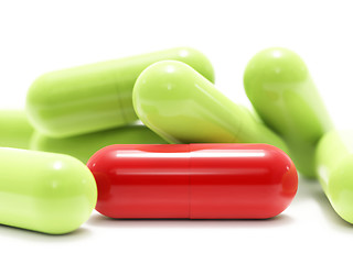 Image showing Red and green pills on white