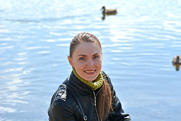 Image showing Woman against lake