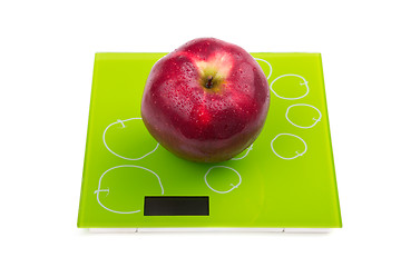 Image showing Red apple on scales