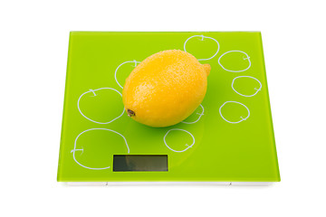 Image showing Yellow lemon on square scales