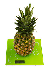 Image showing Pineapple on square kitchen scales