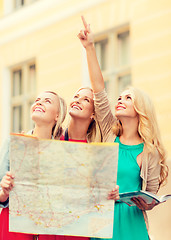 Image showing beautiful women with tourist map in the city