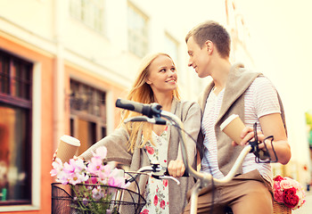 Image showing couple with bicycles in the city