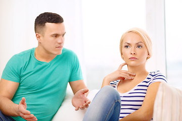 Image showing unhappy couple having argument at home