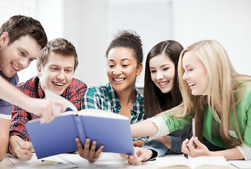 Image showing students reading book at school