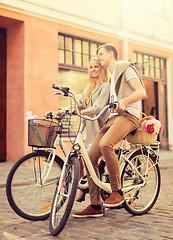 Image showing couple with bicycles in the city