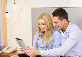 Image showing couple with tablet pc computer in hotel room