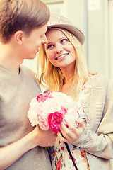 Image showing couple with flowers in the city