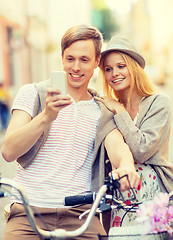 Image showing couple with bicycles in the city