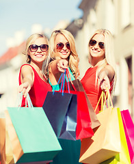 Image showing beautiful women with shopping bags in the ctiy