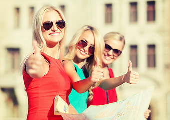 Image showing beautiful women with tourist map in the city