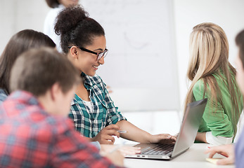 Image showing african student girl with laptop at school