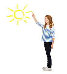 Image showing girl drawing big sun in the air