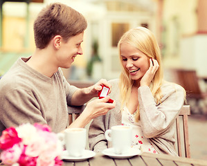 Image showing romantic man proposing to beautiful woman