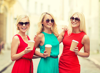Image showing women with takeaway coffee cups in the city