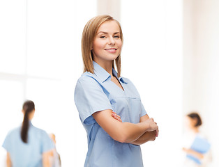 Image showing smiling female doctor or nurse