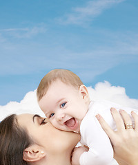 Image showing laughing baby playing with mother