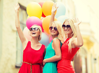 Image showing beautiful girls with colorful balloons in the city