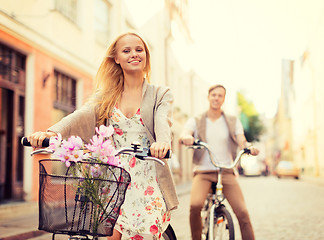 Image showing couple with bicycles in the city