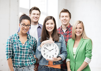 Image showing group of students at school with clock