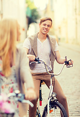 Image showing couple with bicycles in the city