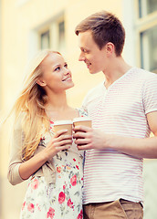 Image showing couple in the city with takeaway coffee cups