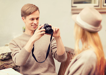 Image showing couple taking photo picture in cafe