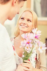 Image showing couple with flowers in the city