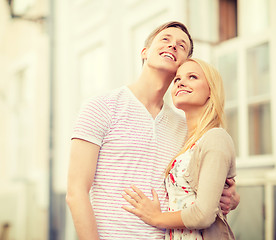 Image showing romantic couple in the city looking up