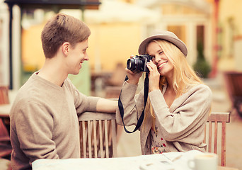 Image showing couple taking photo picture in cafe