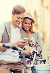 Image showing couple with bicycles in the city